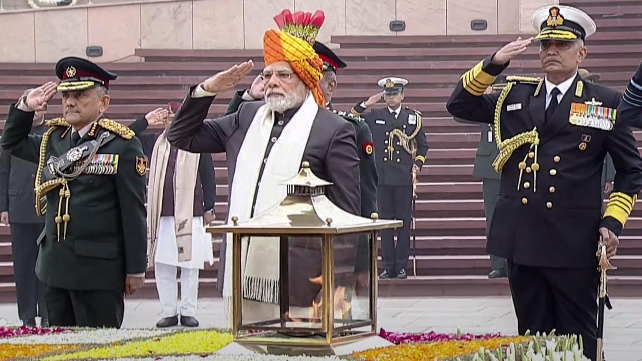 Prime Minister Narendra Modi with Chief of Defence Staff General Anil Chauhan and Chief of Naval Staff Admiral R Hari Kumar pays homage at the National War Memorial on the occasion of 74th Republic Day. Pic/PTI